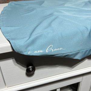 blue “I am brave” low back Illuminative top